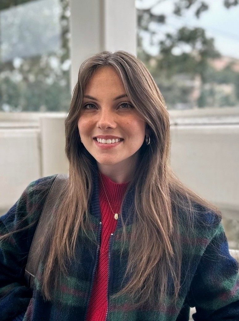 Hanna Smith photo in red shirt and plaid jacket